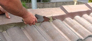 ReKote roofer repairing damaged roof tiles in the Illawarra