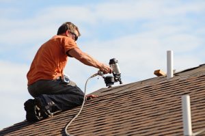 A roofing contractor at work